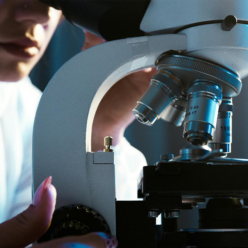 Woman using a microscope