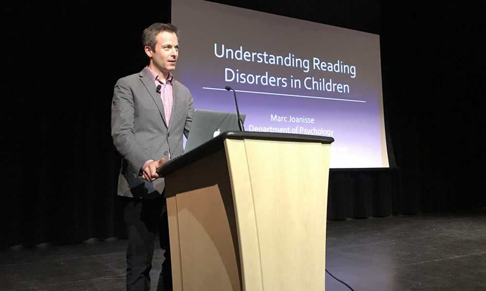 Professor Marc Joanisse speaking at the London Central Library