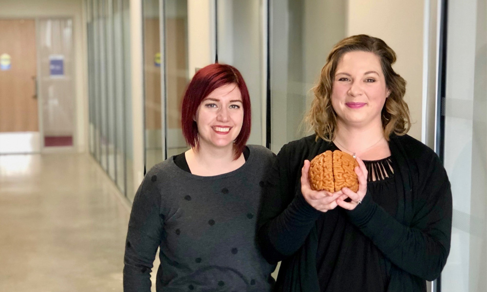 Amy Reichelt and Cassandra Lowe in the Western Interdisciplinary Research Building (WIRB).