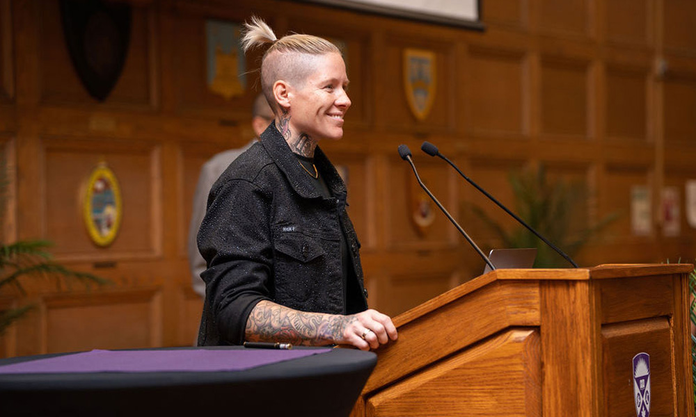 Jen Kish, former captain of Canada's women's rugby sevens team, addressing the attendees of BrainsCAN's Research Impact Day.