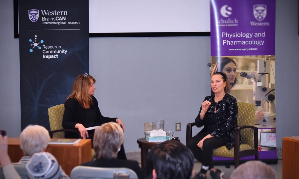 Lisa Saksida, left, and Kirsty Duncan, right, speaking at Western University on March 3.