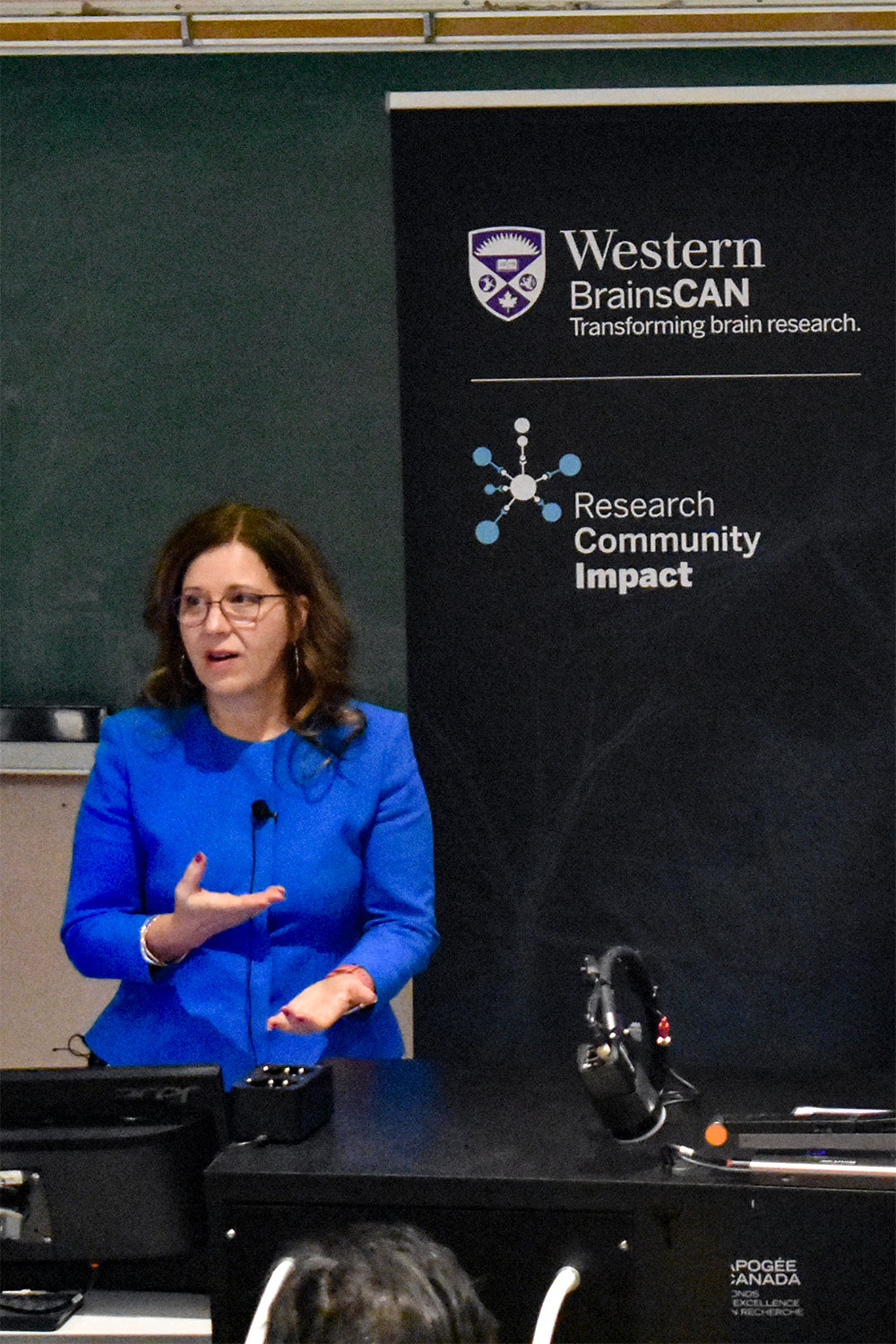 Liisa Galea presenting at the talk